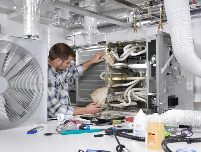 Medfield Air Duct Cleaning specialist performing precision AC coil cleaning in Medfield