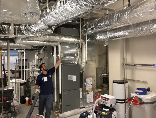 Medfield Air Duct Cleaning specialist performing thorough furnace duct cleaning in a Medfield residence