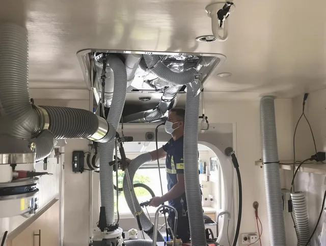 Medfield Air Duct Cleaning specialist performing precise mobile home duct cleaning in Medfield
